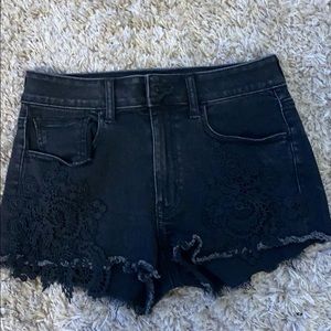 Black jean shorts w/ lace appliqué